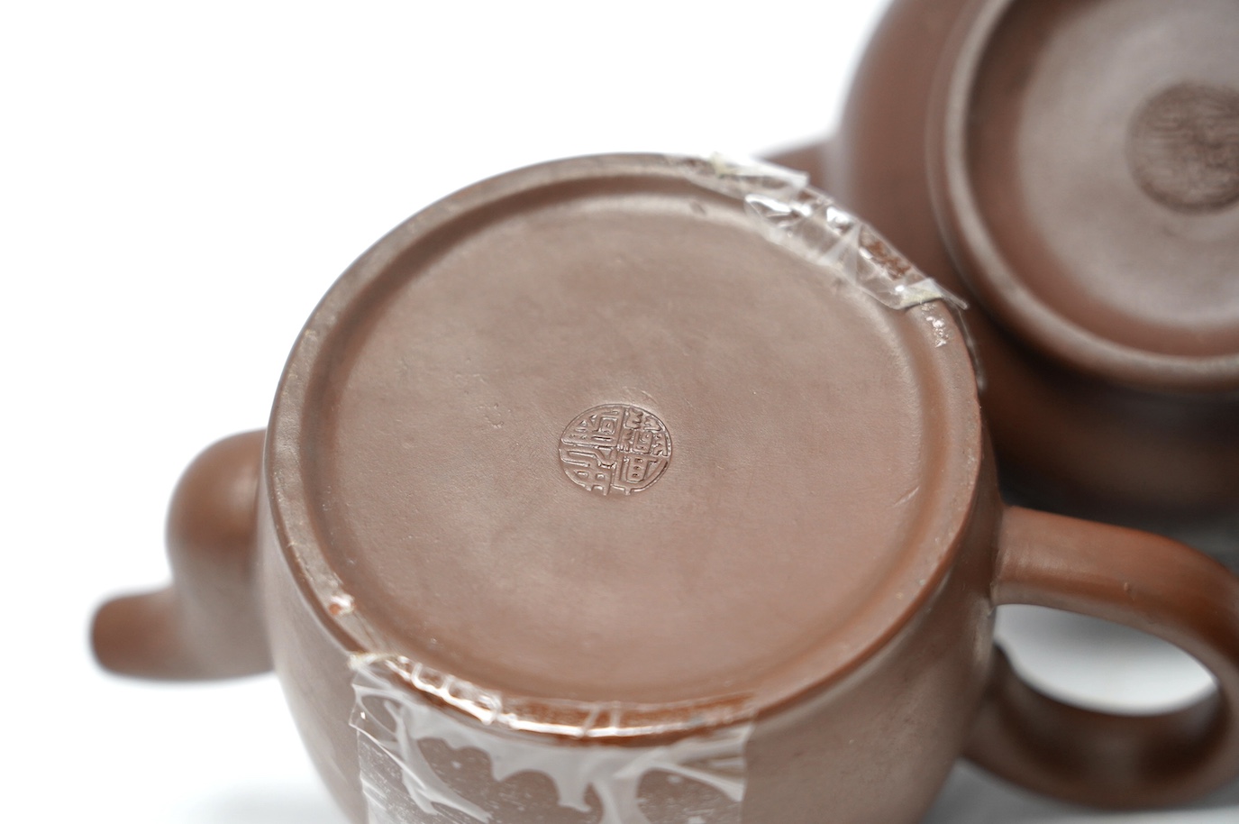 Three Yixing teapots, one double walled lattice worked body, tallest 11cm. Condition - good